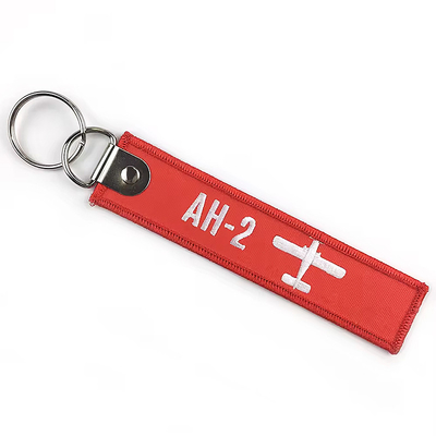 Al dettaglio Olecranon Hook Barato Fabrica di volo personalizzata ricamo Jet tag Portachiavi tessuti con il tuo logo