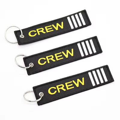 Al dettaglio Olecranon Hook Barato Fabrica di volo personalizzata ricamo Jet tag Portachiavi tessuti con il tuo logo