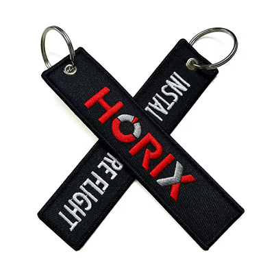 Al dettaglio Olecranon Hook Barato Fabrica di volo personalizzata ricamo Jet tag Portachiavi tessuti con il tuo logo