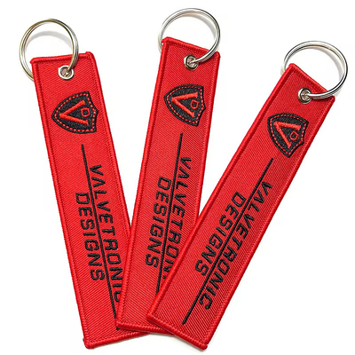 Al dettaglio Olecranon Hook Barato Fabrica di volo personalizzata ricamo Jet tag Portachiavi tessuti con il tuo logo