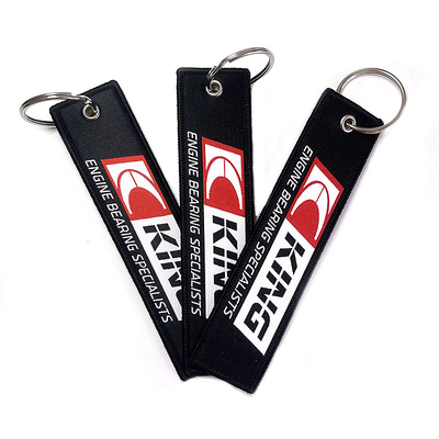 Logo personalizzato Tissu tag chiave ricamati Logo tessuto prima del volo Jet Tag chiaviere Come regalo
