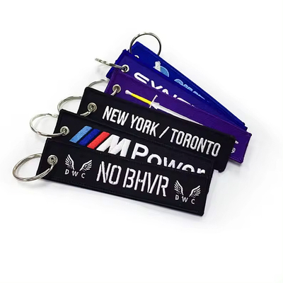 Logo personalizzato Jet Tags Tessuto Ricamo Stampato Portachiavi Leggera Ricamo