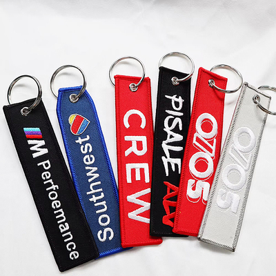 Logo personalizzato Jet Tags Tessuto Ricamo Stampato Portachiavi Leggera Ricamo