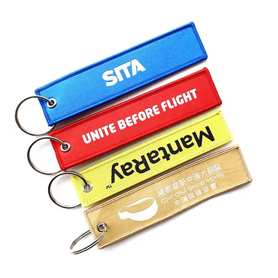 Logo personalizzato Regali promozionali Jet Tag Tessuto ricamo Portachiavi auto Portachiavi tessuti